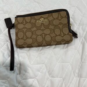 COACH Corner Zip Wristlet. canvas and smooth leather. beige color and khaki